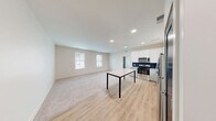 This well-appointed one-bedroom, one-bathroom residence in Perrysburg, Ohio offers a thoughtfully designed open-concept layout that seamlessly connects the kitchen and living area. The kitchen is a standout feature, showcasing white shaker-style cabinetry, granite countertops, a bold navy blue tile backsplash, and a full suite of stainless steel appliances including a range, microwave, dishwasher, and refrigerator. Light wood-style flooring runs throughout the kitchen and dining area, transitioning to plush carpet in the living and bedroom spaces.

The spacious bedroom receives abundant natural light through dual windows with views of the surrounding neighborhood and features soft carpet underfoot. A vaulted ceiling accent adds architectural interest to the room. The unit includes three closets with wire shelving systems, providing ample and well-organized storage throughout.

The bathroom is finished with the same granite countertop detailing found in the kitchen, paired with gray cabinetry, wood-style flooring, and a bright window that fills the space with natural light. Recessed lighting throughout the main living area adds a clean, modern touch. The overall aesthetic is bright, neutral, and move-in ready, making this a practical and stylish space in Perrysburg.