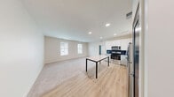 This well-appointed one-bedroom, one-bathroom residence in Perrysburg, Ohio offers a thoughtfully designed open-concept layout that seamlessly connects the kitchen and living area. The kitchen is a standout feature, showcasing white shaker-style cabinetry, granite countertops, a bold navy blue tile backsplash, and a full suite of stainless steel appliances including a range, microwave, dishwasher, and refrigerator. Light wood-style flooring runs throughout the kitchen and dining area, transitioning to plush carpet in the living and bedroom spaces.

The spacious bedroom receives abundant natural light through dual windows with views of the surrounding neighborhood and features soft carpet underfoot. A vaulted ceiling accent adds architectural interest to the room. The unit includes three closets with wire shelving systems, providing ample and well-organized storage throughout.

The bathroom is finished with the same granite countertop detailing found in the kitchen, paired with gray cabinetry, wood-style flooring, and a bright window that fills the space with natural light. Recessed lighting throughout the main living area adds a clean, modern touch. The overall aesthetic is bright, neutral, and move-in ready, making this a practical and stylish space in Perrysburg.