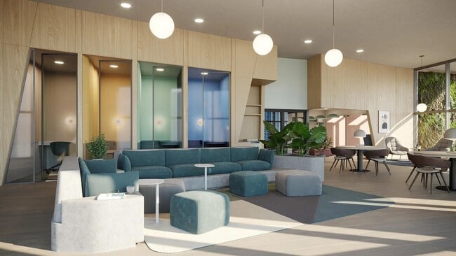Coworking space with work pods and comfortable seating areas at Modera Riverside in Miami, FL. - Modera Riverside