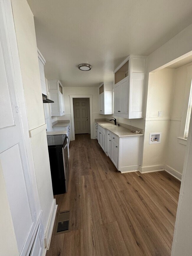 Building Photo - Beautiful hardwood floors throughout!