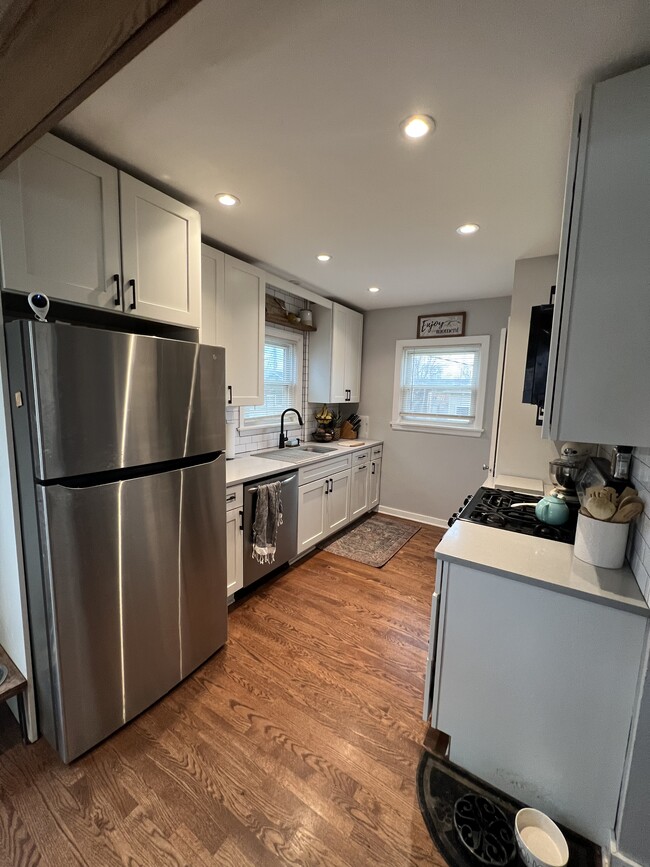Fully remodeled kitchen. Quartz counters, stainless steel appliances. Dishwasher. - 7336 Tapper Ave