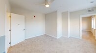 This sprawling single-story complex at 250 College Ave, Lancaster, PA, offers an impressive 23,090 square feet of living space. The property boasts 31 bedrooms and 27 bathrooms, making it ideal for large-scale communal living or student housing. The modern interior design is characterized by clean lines, neutral color palettes, and ample natural light.

Each bedroom, averaging around 190 square feet, provides a comfortable personal space. The bathrooms feature sleek fixtures, light-toned tile flooring, and spacious vanities. Large windows in many rooms offer views of the surrounding area and flood the spaces with natural light.

The property includes 24 kitchens, ensuring convenient access to cooking facilities throughout the complex. Eight laundry areas are strategically placed, offering practical amenities for residents. The single living room serves as a communal gathering space.

The interior is finished with a mix of carpeted and hard surface flooring, creating a balance of comfort and easy maintenance. Ceiling fans in some rooms provide additional comfort and air circulation. The building's layout, visible in the floor plan image, shows an efficient design that maximizes space utilization.

Safety features are evident, with visible fire alarm systems in place. The property's multiple staircases (4) and hallways (14) ensure easy navigation and emergency egress. With its extensive facilities and thoughtful design, this property is well-suited for institutional or multi-family use, offering a blend of private spaces and shared amenities.