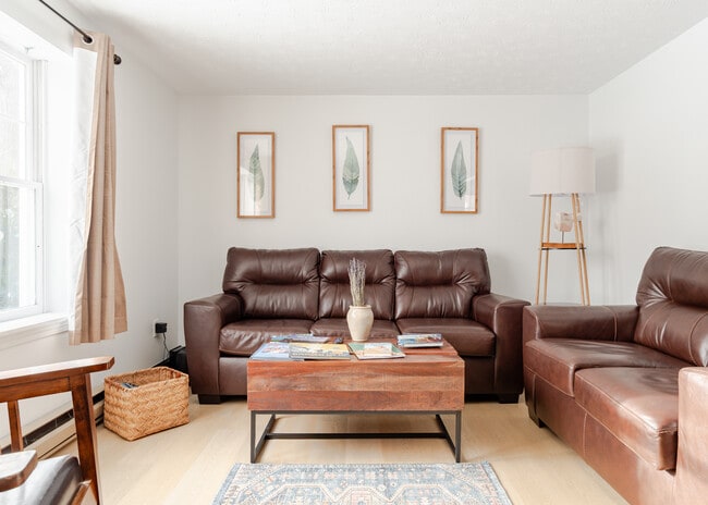 living room with two couches and large TV - 49 Berkshire Rd