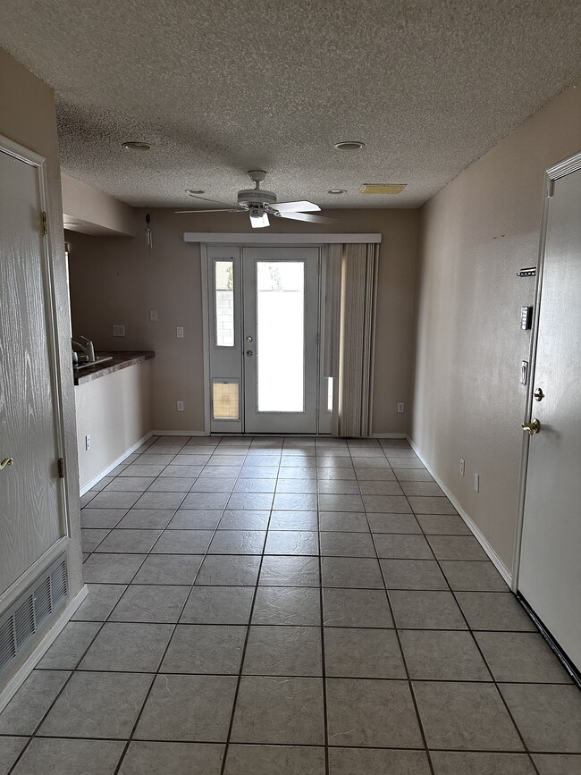 Dining area facing back door and showing doggy door - 4791 W Red Wolf Dr