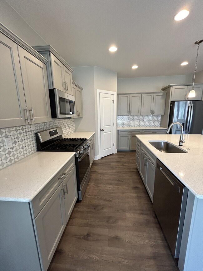 Building Photo - 4-Bedroom Home with Fireplace at 6192 Harm...