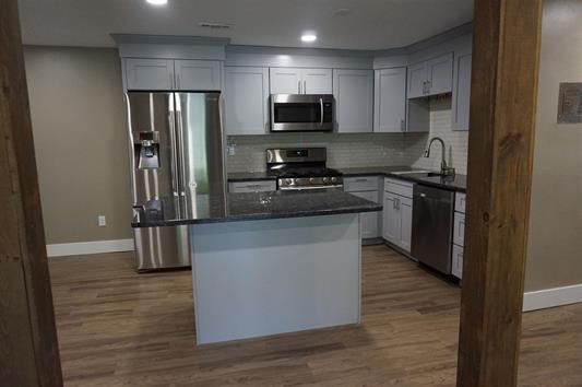 Exposed beams and kitchen - 4 Brookside Dr