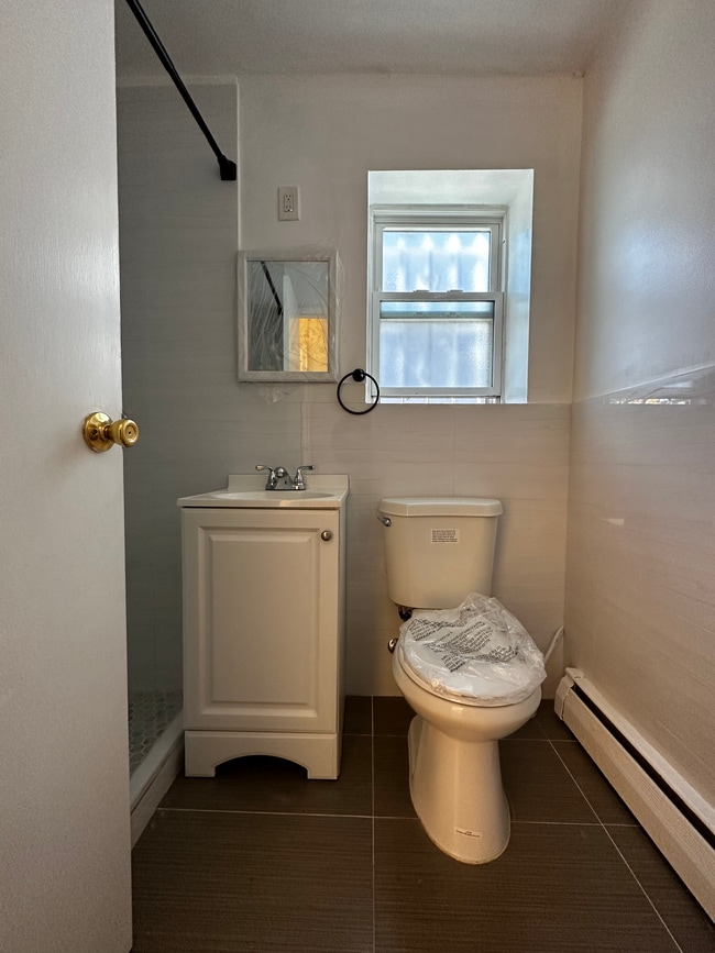 Newly installed toilet and vanity - 2892 Coddington Ave