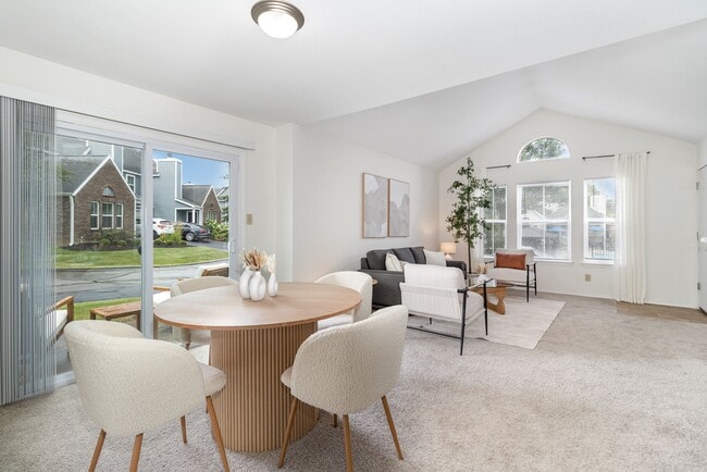 Step into a dining space designed for connection and conversation, perfect for sharing meals and making memories. - Windridge Townhomes