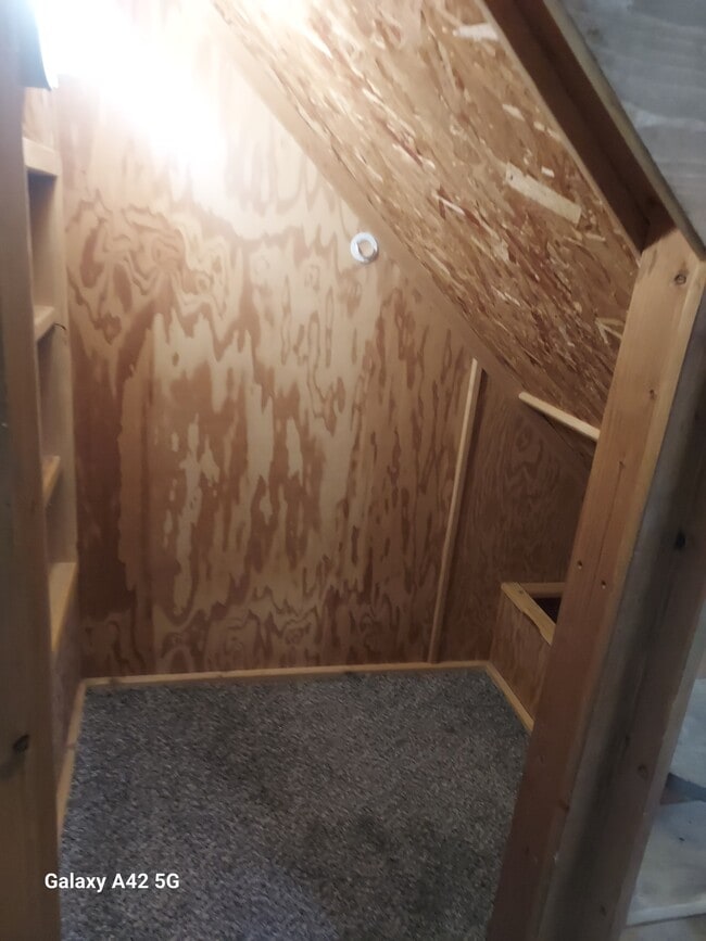 Under the stairs in basement - 835 W Wyeth St