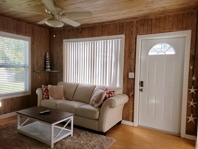 Living room. This beautiful couch opens to a queen sized bed. - 17 NE 9th St