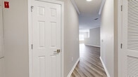 Located at 1000 Central Ave in Matawan, NJ, this well-appointed three-bedroom, two-bathroom home offers comfortable single-floor living with thoughtfully designed interiors throughout. Light-toned luxury vinyl plank flooring runs through the main living areas, complemented by crisp white trim, crown molding, and a neutral color palette that creates a clean, modern aesthetic.

The inviting hallway connects seamlessly to an open living area bathed in natural light from large windows. The kitchen features white shaker-style cabinetry, marble-look countertops, and stainless steel appliances, including a refrigerator, range, and over-the-range microwave — all set against warm LVP flooring.

The primary bedroom is generously sized and adjoins a well-appointed bathroom with a wide marble-topped vanity, white cabinetry, brushed nickel fixtures, and a large mirror. Two additional bedrooms offer plush carpeting and natural light from bright windows, providing comfortable and versatile spaces. Two dedicated closets offer practical storage solutions, including one walk-in style closet with wire shelving.

Two full bathrooms serve the home with refined finishes throughout. Crown molding, consistent flooring, and a cohesive design language give this home a polished, move-in ready feel.