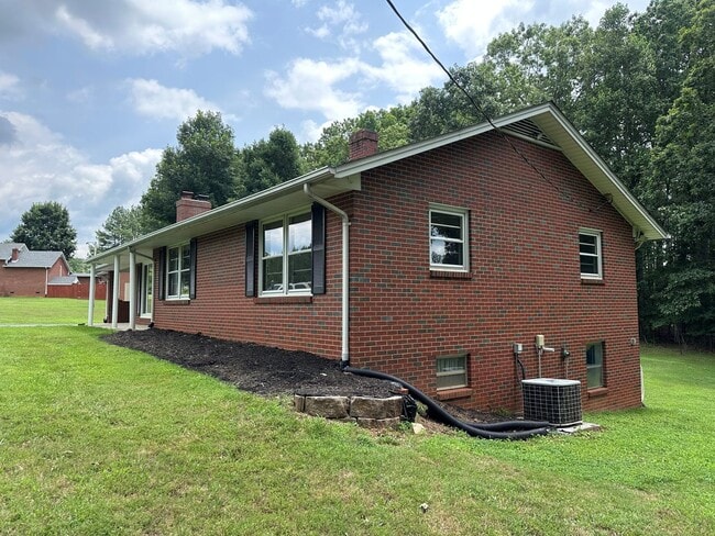 Building Photo - Spacious brick house with a caport and unf...