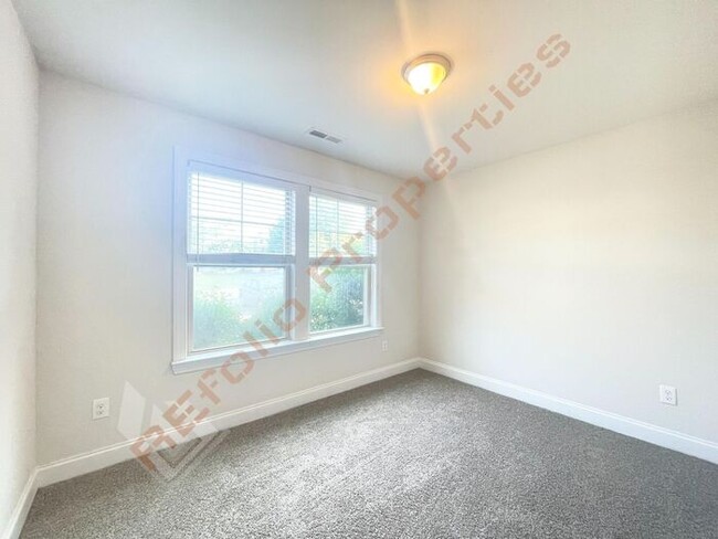 Building Photo - Fresh Paint and New Carpet Flooring! Beaut...