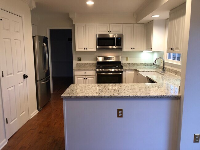 Kitchen with stainless steel appliances - 41 Bridle Ln