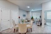 Located at 300 Riverfront Boulevard in Elmwood Park, NJ, this well-appointed 1-bedroom, 1-bathroom residence offers a thoughtfully designed single-floor layout. The open-concept living, dining, and kitchen area serves as the heart of the home, featuring light hardwood-style flooring, recessed lighting, and a soft, neutral color palette throughout. The kitchen is outfitted with crisp white cabinetry, a light blue subway tile backsplash, white quartz countertops, stainless steel appliances including a French door refrigerator, range, built-in microwave, and dishwasher, as well as a peninsula that provides additional prep space and seating. The living area is bright and airy, benefiting from natural light through a large window. A separate den offers flexible additional living space. The primary bedroom is a comfortable retreat with large windows, light hardwood-style floors, and ample closet storage. The bathroom features clean white tile flooring, a tub/shower combination with mosaic accent tile, and a streamlined, functional design. Additional highlights include in-unit laundry, two closets, and two utility rooms, providing exceptional storage and convenience throughout.