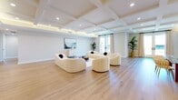 Located at 1825 Pandora Ave in Los Angeles, this thoughtfully designed single-story home offers four bedrooms and five bathrooms across a generously proportioned floor plan. The open-concept living and dining area immediately impresses with its striking coffered ceiling accented by recessed ambient lighting, light hardwood floors, and a seamless flow that makes the space feel expansive and inviting.

The gourmet kitchen is a standout feature, finished with crisp white cabinetry, dramatic black marble countertops and backsplash, travertine tile flooring, and a professional-grade stainless steel range with a statement hood. The kitchen is designed for both function and style, offering abundant storage and counter space.

The primary bedroom is generously sized, featuring recessed lighting and a dedicated closet with warm wood-paneled interiors and chrome hanging rails. Each of the four bedrooms is finished with light hardwood floors and neutral tones; select rooms include French doors that open to outdoor views, enhancing the sense of natural light and connectivity to the exterior.

The five bathrooms are elegantly appointed, showcasing large-format stone tile surrounds, soaking tub and shower combinations enclosed in frameless glass, and clean contemporary fixtures throughout. Every detail reflects a commitment to refined, modern living in the heart of Los Angeles.