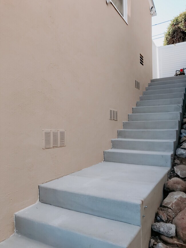 Stairs on side of house to get to your front door - 1325 Elevation Rd