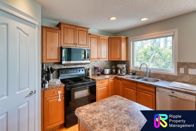 Building Photo - 75 Cougarstone Way SW