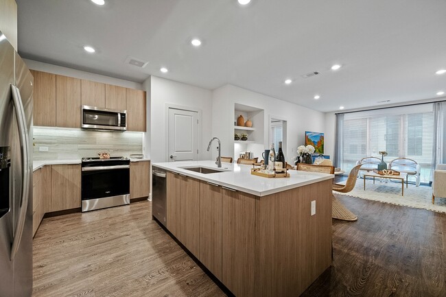 Chef-inspired kitchen with neutral tone finishes and spacious island - Hanover Toscana