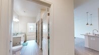 Located at 6505 Collins Rd in Jacksonville, FL, this thoughtfully designed one-bedroom, one-bathroom unit offers a functional and modern living experience. The open-concept kitchen and living area serves as the heart of the home, featuring light wood-style flooring, white shaker cabinetry, granite countertops, a subway tile backsplash, and stainless steel appliances including a refrigerator, range, and microwave. A peninsula with pendant lighting provides casual seating and additional workspace. The living area is bright and airy, enhanced by a ceiling fan and access to natural light through large windows and a glass-paneled door. The bedroom is generously sized, finished with plush carpet and multiple windows that invite ample daylight. A hallway connects the main living spaces to the bedroom and bathroom, with a dedicated closet for storage. The bathroom offers a clean, contemporary design with a granite-topped vanity, modern fixtures, wood-style flooring, and a tiled shower. Neutral tones and consistent finishes throughout create a cohesive and welcoming ambiance, making this unit a comfortable and practical residence.