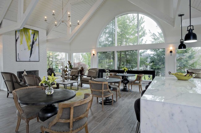 Enjoy a Cup of Starbucks at One of the Cafe Tables - Royal Oaks Apartments