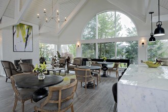 Enjoy a Cup of Starbucks at One of the Cafe Tables - Royal Oaks Apartments