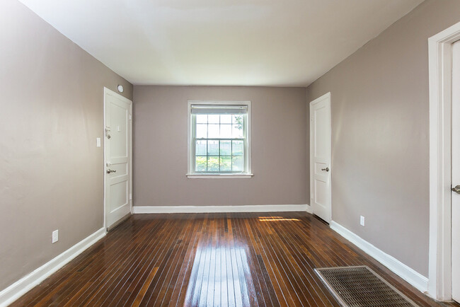 Livingroom with tons of natural light. - Village Square