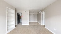 Located at 6233 Gulfton St in Houston, TX, this single-story, 3-bedroom, 2-bathroom home offers a practical and functional layout across a compact, efficiently designed floor plan. The bedrooms are carpeted and each equipped with a ceiling fan and a dedicated closet, providing comfortable and organized living spaces. The generously sized primary bedroom features a window with blinds that allows natural light to filter in, creating a bright and airy atmosphere. The two additional bedrooms also include ceiling fans and closets with built-in shelving rods for convenient storage. Both bathrooms feature tile flooring, tub-shower combinations with white tile surrounds, and one includes a granite-topped vanity, adding a touch of elegance. The kitchen is outfitted with gray cabinetry, granite countertops, and a striking stone mosaic tile backsplash that adds visual interest to the space. The adjacent dining area features light tile flooring and a pendant light fixture overhead. A clean, neutral color palette of soft grays and whites throughout the home creates a cohesive and move-in ready aesthetic, while ceiling fans in multiple rooms ensure year-round comfort.