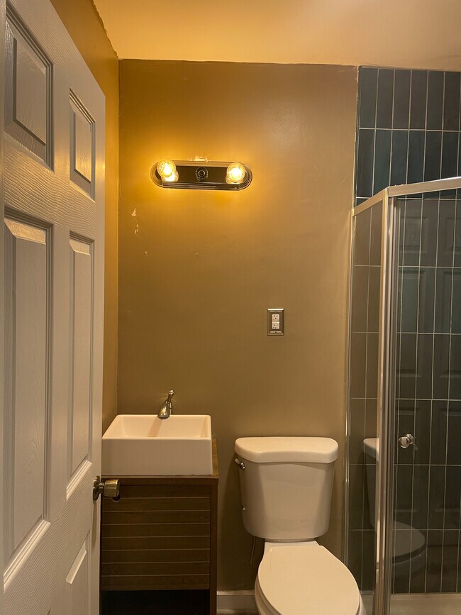 Bathroom has a mirror above the sink installed. - 1022 NW 4th Ave