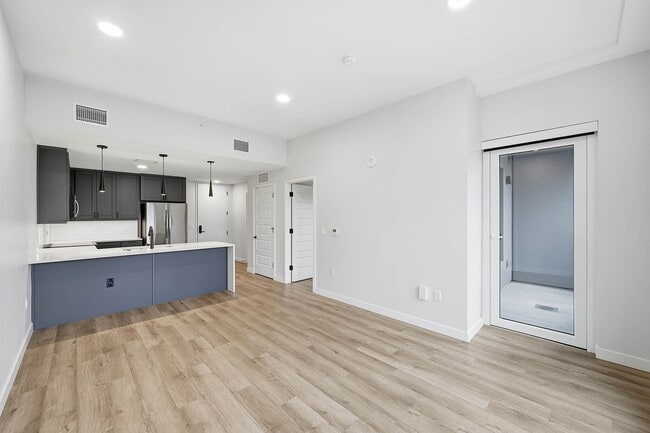 Living room with access to private balcony - AMLI Golden Triangle