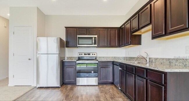 Stainless steel appliances with granite countertop - 657 Madison Dr