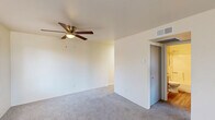 Located in Prescott, Arizona, this single-floor, 2-bedroom, 1-bathroom unit offers a practical and well-organized layout. The entry opens into a carpeted living area with a window that lets in natural light and frames views of the surrounding greenery and rocky Prescott landscape. A hallway connects the main living space to the kitchen, bedrooms, and bathroom.

The kitchen features gray upper and lower cabinetry, light-toned countertops, a full-size refrigerator, and vinyl wood-look flooring that adds warmth and is easy to maintain. The bathroom is clean and functional, with a full tub-shower combination, a gray vanity, toilet, and matching vinyl wood flooring.

The spacious primary bedroom is the largest room in the unit, offering generous floor space with plush carpet, two windows that provide ample natural light and outdoor views, a ceiling fan with integrated lighting, and a wall-mounted HVAC unit for independent climate control. The second bedroom also features carpet flooring and a window with views of the surrounding neighborhood and natural terrain.

Neutral wall tones throughout the unit create a clean, move-in-ready canvas. This Prescott residence offers a straightforward and comfortable layout suited for those seeking a manageable, low-maintenance living space in Arizona's scenic high desert.