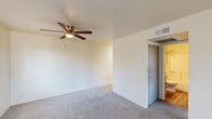 Located in Prescott, Arizona, this single-floor, 2-bedroom, 1-bathroom unit offers a practical and well-organized layout. The entry opens into a carpeted living area with a window that lets in natural light and frames views of the surrounding greenery and rocky Prescott landscape. A hallway connects the main living space to the kitchen, bedrooms, and bathroom.

The kitchen features gray upper and lower cabinetry, light-toned countertops, a full-size refrigerator, and vinyl wood-look flooring that adds warmth and is easy to maintain. The bathroom is clean and functional, with a full tub-shower combination, a gray vanity, toilet, and matching vinyl wood flooring.

The spacious primary bedroom is the largest room in the unit, offering generous floor space with plush carpet, two windows that provide ample natural light and outdoor views, a ceiling fan with integrated lighting, and a wall-mounted HVAC unit for independent climate control. The second bedroom also features carpet flooring and a window with views of the surrounding neighborhood and natural terrain.

Neutral wall tones throughout the unit create a clean, move-in-ready canvas. This Prescott residence offers a straightforward and comfortable layout suited for those seeking a manageable, low-maintenance living space in Arizona's scenic high desert.