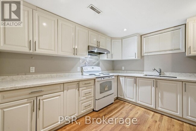 Photo du bâtiment - 54 Minnacote Ave