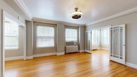 Located at 1058 N Grant St in Denver's vibrant Capitol Hill neighborhood, this single-floor unit offers a thoughtfully arranged layout with a blend of classic architectural charm and functional design. The space features multiple living areas connected by two hallways, providing a natural flow throughout. The living rooms are highlighted by warm hardwood flooring, crisp crown molding, generous natural light from multiple windows with blinds, and vintage-style ceiling light fixtures. Cast-iron radiators add a period-appropriate character and provide efficient heating throughout. A dedicated office space and a well-proportioned closet offer practical utility. The kitchen is equipped with light maple cabinetry, dark granite countertops, stainless steel appliances including a gas range and refrigerator, and a striking black-and-white checkered tile floor that also extends into additional rooms, creating a bold visual contrast. The bathroom retains its classic character with white hex mosaic tile flooring, white wainscoting, a pedestal sink, and a window that brings in natural light. A dedicated entrance with a rich dark wood door welcomes residents into the space. Overall, the unit presents a timeless aesthetic rooted in early 20th-century Denver architecture with well-preserved details throughout.