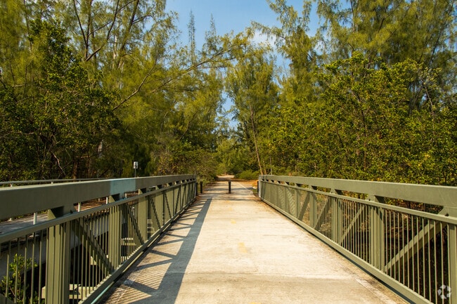At Arch Creek East Environmental Preserve, find a bridge that crosses the canal.