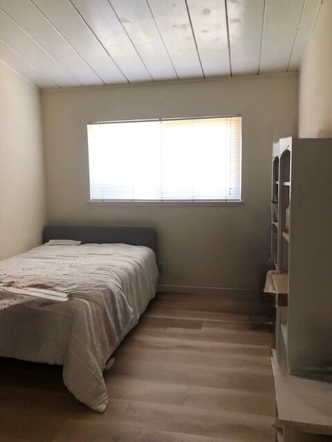 stagged bedroom - 3133 Alma St