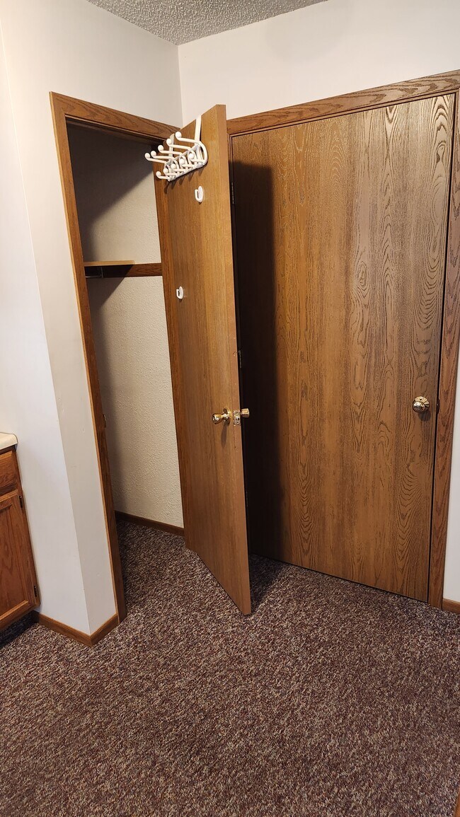 Coat closet beside entry door - 2796 E McMillan Rd