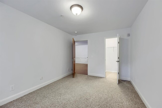 Bedroom with walk in closet - Stewart Woods Apartments