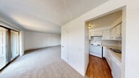This 2-bedroom, 1-bathroom unit at Park Ridge in Bremerton, WA offers a comfortable and functional single-floor layout. The living room is generously proportioned, featuring soft carpeting, a textured ceiling, baseboard heating, and a sliding glass door that opens to a private balcony with views of the surrounding greenery. Natural light filters in through multiple windows, creating a bright and welcoming atmosphere throughout.

The kitchen is efficiently laid out with warm hardwood-style flooring, white cabinetry, a tiled backsplash, and white appliances including a refrigerator, electric range, and dishwasher. A double-basin sink completes the functional workspace.

Both bedrooms are carpeted and well-lit by natural light from windows overlooking the outdoors. Each room includes baseboard heating and generous closet space — the unit features four closets in total, providing excellent storage throughout. The primary bedroom is a comfortable size, with direct access to the balcony via a sliding glass door.

The full bathroom includes a combined tub and shower with clean, white surroundings. The unit's neutral white walls, consistent flooring choices, and practical layout make it a versatile and move-in-ready home in the heart of Bremerton, WA.