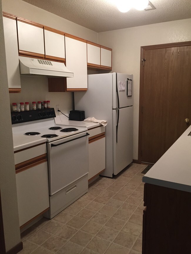 Kitchen with door to garage - 117 Cannery Row