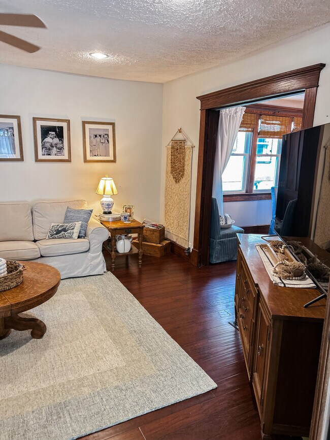 Main living area continued that connects to dining and kitchen area - 106 E Madison Ave