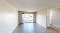 Located in Citrus Heights, CA, this well-maintained one-bedroom, one-bathroom unit offers a practical and comfortable single-floor layout. The living room is bright and open, featuring wood-style laminate flooring, neutral beige walls, white baseboards, and a textured ceiling. A large sliding glass door floods the space with natural light and provides direct access to an outdoor patio area, with views of the surrounding neighborhood. The entry door features classic six-panel detailing, adding a clean, traditional touch.

The bedroom is a comfortable, carpeted retreat with soft, neutral-toned carpet and a sliding window that brings in natural light and neighborhood views. The room offers ample wall space for flexible furniture arrangements and includes access to a dedicated closet for storage. A connecting hallway efficiently links the bedroom, bathroom, and closet, keeping the layout organized and functional.

The bathroom is clean and compact, featuring a full-size tub and shower combination lined with white subway tile, brushed nickel fixtures, and wood-style flooring that ties in with the rest of the unit. Throughout the home, the consistent use of neutral tones, light flooring, and white trim creates a cohesive and move-in-ready aesthetic ideal for those seeking low-maintenance, comfortable living in Citrus Heights.