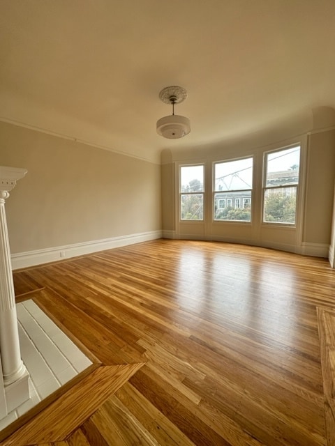 Bright and sunny living room with original hardwood floors, recently refinished - 2332 Divisadero St