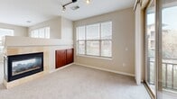 This 1130 square foot townhome in Englewood, Colorado offers a modern living experience across two floors. The main level boasts an open-concept design, combining the kitchen, living room, and dining area. The kitchen features rich wood cabinetry, stainless steel appliances, and granite countertops, creating a sleek and functional cooking space. A fireplace in the living room adds warmth and character.

The home includes two bedrooms, with the primary bedroom measuring 150 square feet. Two full bathrooms provide convenience, both featuring wood vanities, granite countertops, and one with a bathtub-shower combination. Plush carpeting in the bedrooms and living areas contrasts with hardwood flooring in the kitchen and bathrooms, adding texture and warmth.

Large windows throughout allow for ample natural light, while horizontal blinds offer privacy control. The property includes two closets for storage, and the images reveal wire shelving systems for organization. A hallway connects the various rooms, ensuring a smooth flow throughout the space.

The townhome's layout, spanning 70 square feet on the ground floor and 1060 square feet on the main floor, provides a comfortable and efficient living arrangement. Located at 9850 Zenith Meridian Dr in Englewood, this property combines modern amenities with a convenient location.