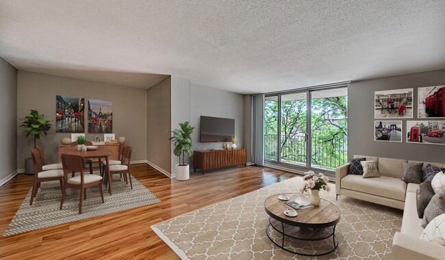 Large open living room opening up to a spacious balcony. - 2200 Grace