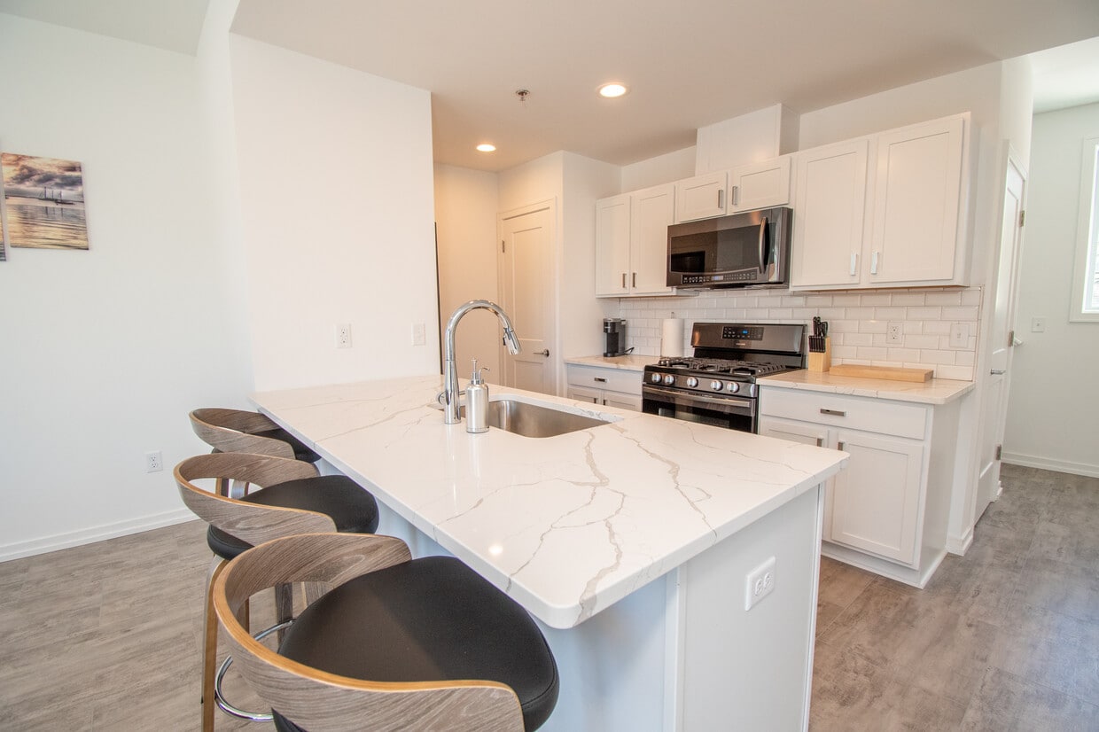 Kitchen - Live Well Apartments - Fully Furnished Units