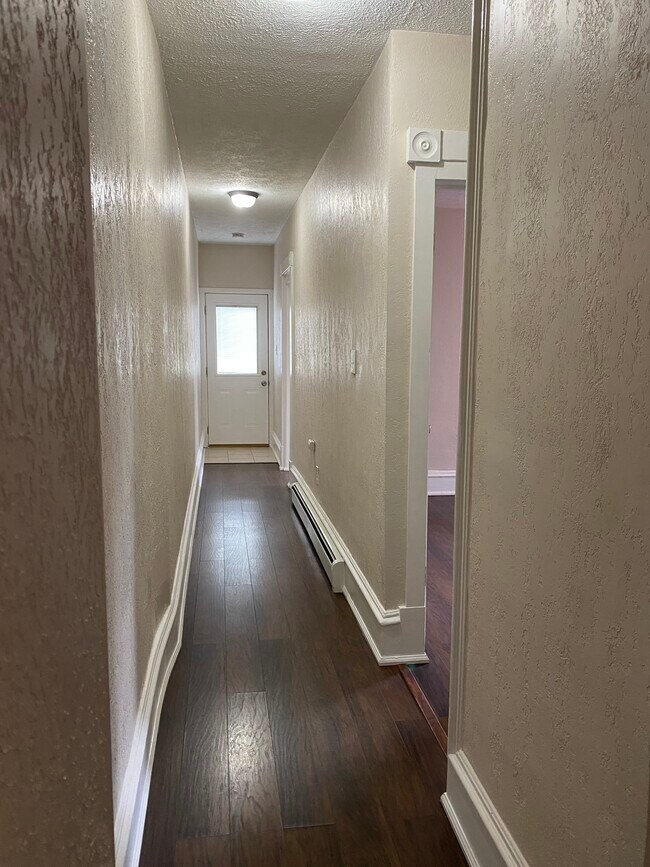 hallway to bedrooms and back door - 1511 12th St
