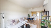 Located at 1230 Avenue De La Croisée in Terrebonne, QC, this well-designed one-bedroom, one-bathroom unit offers a thoughtfully organized layout across a single floor. The open-concept kitchen and living area form the heart of the space, where light wood-toned cabinetry, crisp white flat-panel uppers, and a quartz-topped island with an undermount sink create a clean, contemporary kitchen. A stainless steel range and full-size refrigerator complete the functional cooking space, while a pendant light adds a refined finishing touch. The living area is bright and airy, benefiting from natural light that pours in through a sliding glass door opening onto a private balcony with open views of the surrounding landscape. The bedroom is a calm retreat, featuring a window with an outdoor view, a built-in closet, and light wood flooring that carries throughout the unit. The bathroom is efficiently designed with a floating vanity, wood-accented medicine cabinet, a large mirror, and continued light wood flooring that lends warmth and cohesion. Throughout, the palette of whites and natural wood tones creates a serene, modern ambiance well-suited to everyday living in this Terrebonne residence.