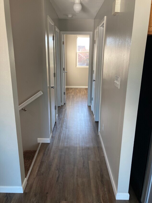 Upstairs hallway connecting upstairs living room to bedrooms - 1080 Fairlane Ct